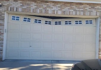 Garage door before repair