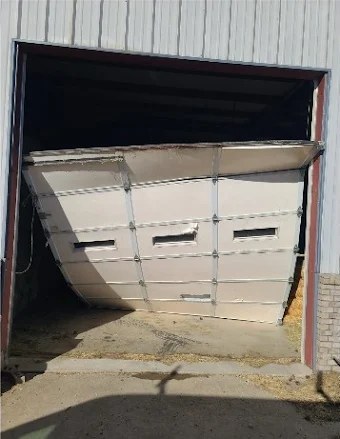 Garage door before repair